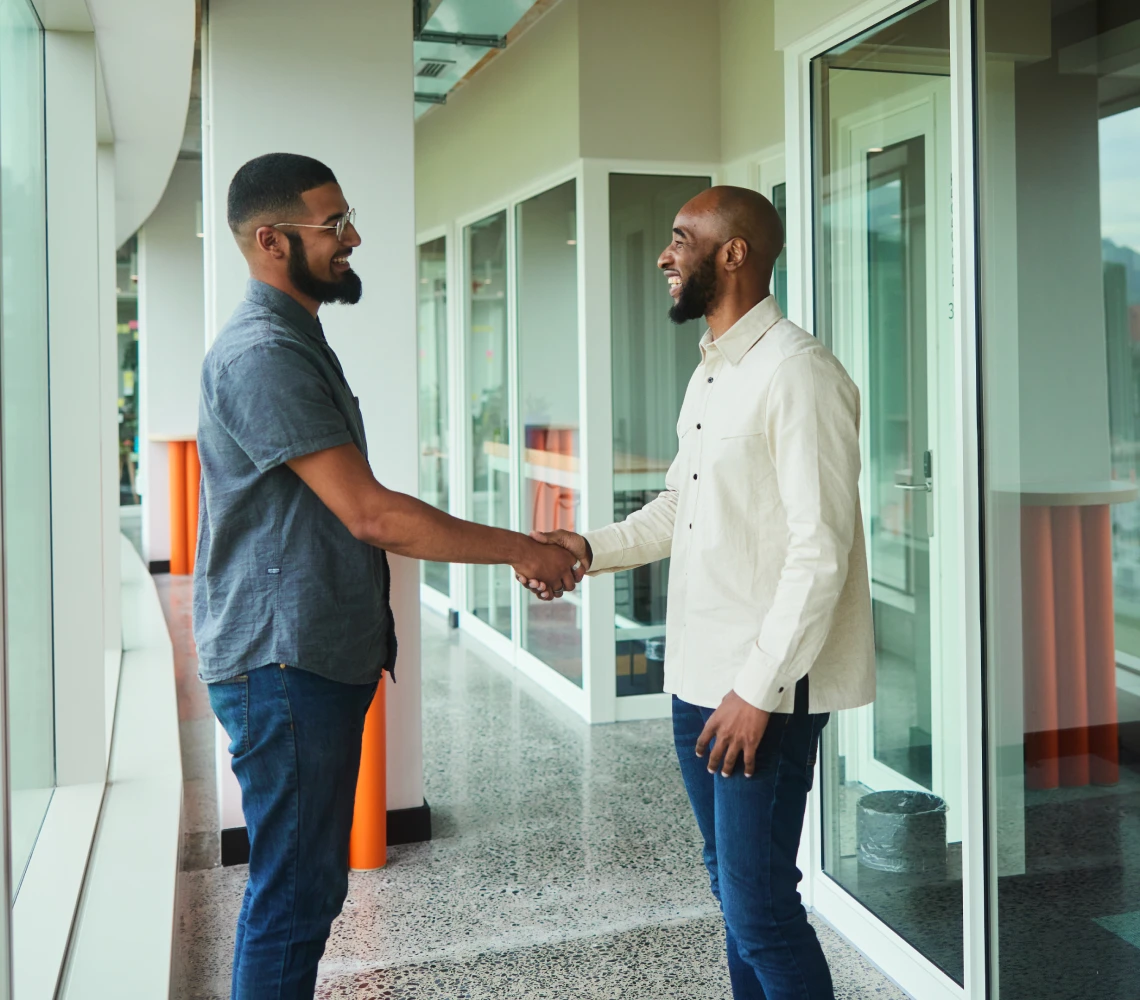 Friendly handshake between coworkers